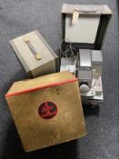 Three cased vintage projectors