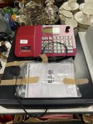 A Casio SE-S700 cash register with instructions and keys