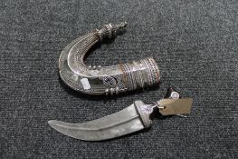 An early 20th century Eastern white metal mounted jambiya dagger in sheath CONDITION