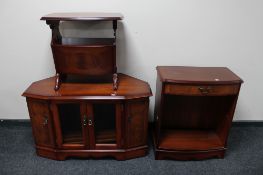 A corner TV stand and a set of open shelves with matching magazine rack