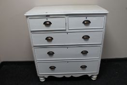 A painted antique pine five drawer chest