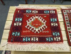 A fringed Caucasian mat,