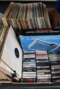 Two boxes of vinyl LP records and cassette tapes,