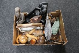 A box of carved tribal art,