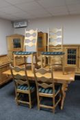 A blonde oak refectory dining table and six chairs