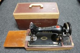 A cased Singer hand sewing machine
