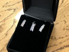 A 10ct white gold tanzanite and diamond pendant,