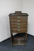 An Edwardian five drawer music cabinet