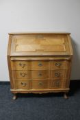A blonde oak bureau