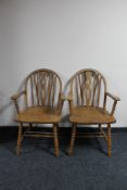 A pair of Windsor style carver armchairs