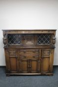 A carved oak court cupboard