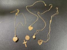 Four 9ct gold pendants on chains,