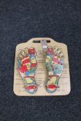 A reflexology pressure point foot model on board