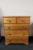 A pine five drawer chest