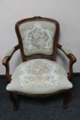 A continental beech framed armchair in tapestry fabric