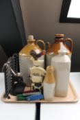 A tray of four pocket knives, cast iron door stop, receipt book stand, two stone ware flaggons,