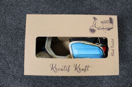 A boxed metal Kreatif Kraft Scooter