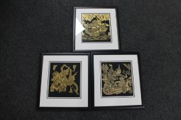 Three framed Indonesian fabric panels depicting warriors and gods