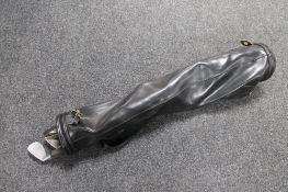 A golf bag of five child's clubs