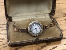 A lady's vintage 18ct gold diamond set cocktail watch on 9ct gold bracelet
