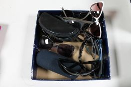 A box of designer sunglasses and prescription glasses to include So-Cal and Company,