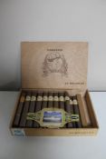 An El Guajiro wooden cigar box containing twenty-two cigars