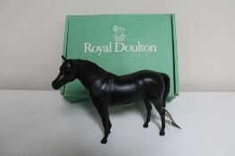 A boxed Royal Doulton horse in black matte finish