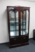 A contemporary mahogany double door display cabinet by Morris of Glasgow, width 89.6 cm.