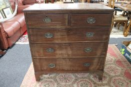 A George III mahogany five drawer chest with metal drop handles