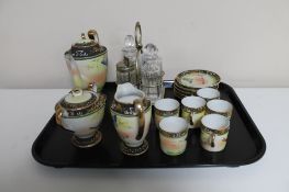 An ornate Japanese porcelain coffee set and a silver plated cruet