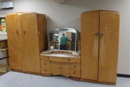 A three piece bird's eye maple bedroom suite
