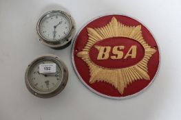 Two circular Smiths clocks and a BSA metal plaque CONDITION REPORT: The sign is a