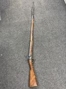 A reproduction long barrelled musket with ramrod and bayonet CONDITION REPORT: