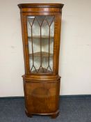 A mahogany corner display cabinet