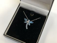 A 14ct white gold blue topaz pendant on 18ct white gold chain, 19.88 mm x 22.42 mm pendant size.