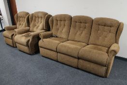 A three piece lounge suite in brown floral fabric