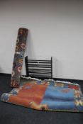 A wooden shoe rack together with two contemporary woolen rugs CONDITION REPORT: The
