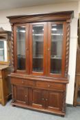 A reproduction mahogany bookcase with glazed doors,