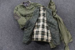 A Barbour quilted body warmer together with a Barbour quilted child's jacket and a Barbour shower