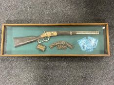 A Winchester model 1886 rifle montage in display case CONDITION REPORT: 106.