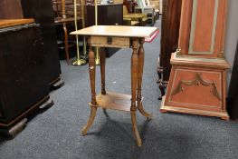 A light oak occasional table fitted a drawer