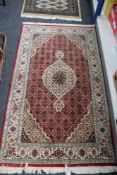 A Tabriz design rug,