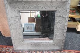 A decorative metal framed mirror