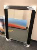 A black ribbed mirror