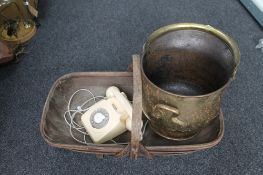 A brass coal helmet together with a vintage trug and an old telephone