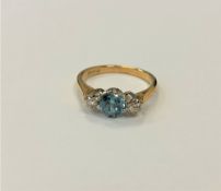 An 18ct gold blue zircon and diamond ring