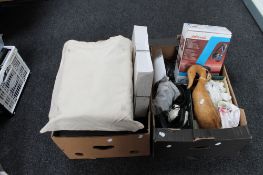 Two boxes containing headphones, wooden duck figure, Kodak carousels,