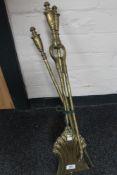 Three brass fire irons
