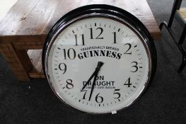 A reproduction wall clock - Guinness on draught
