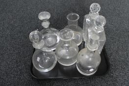 A tray of glass decanters,